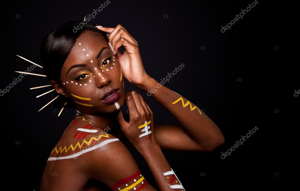  with tribal yellow red and white makeup cosmetics and sticks in hair