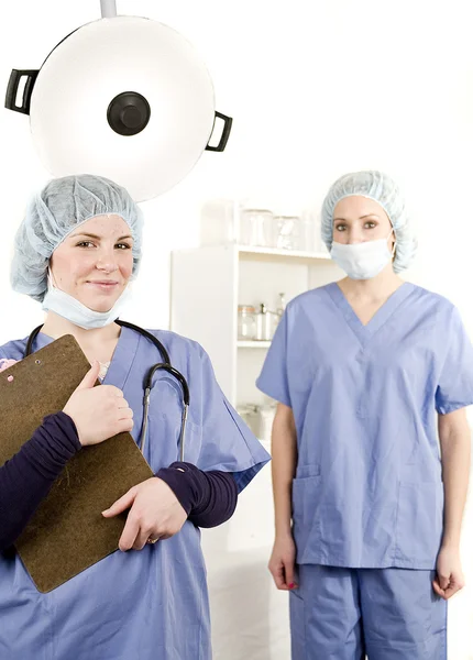 Nurse and doctor in hospital room