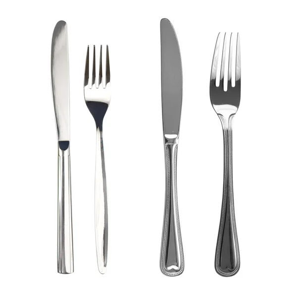 Set of knives and forks isolated — Stock Photo #5313681