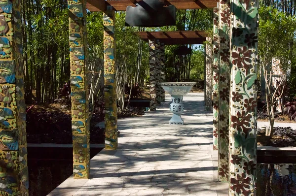 Ornate pillars in tropical garden