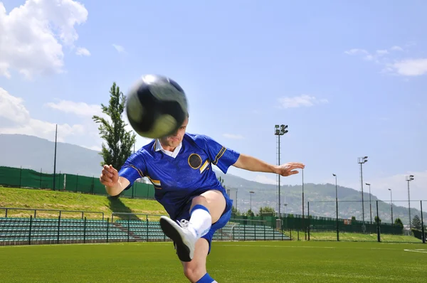 Soccer player shooting ball