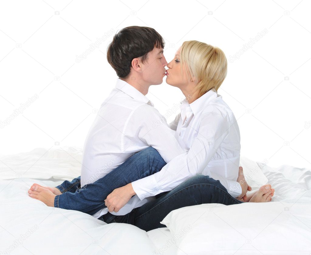 Happy family kissing in bed â€” Stock Photo Â© Lebval #5374553