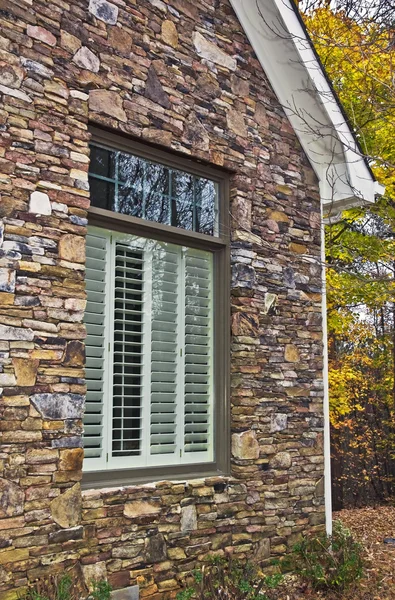 Window Shutters and Stone Facade