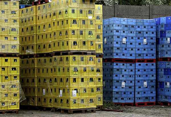 Pallets of boxes yellow and blue (Coloured crates )