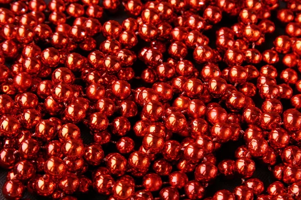 Red shiny costume jewelry background