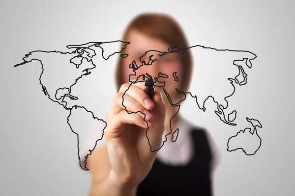 Businesswoman drawing the world map in a whiteboard