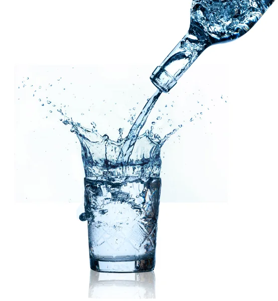 Blue water splashing on glass, white background.
