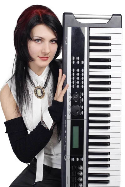 Beautiful girl with synthesizer isolated