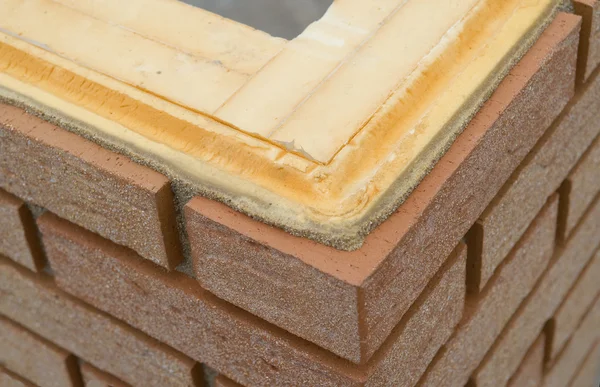 Thermal insulation of a house wall