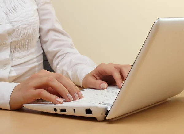 Female hands on laptop