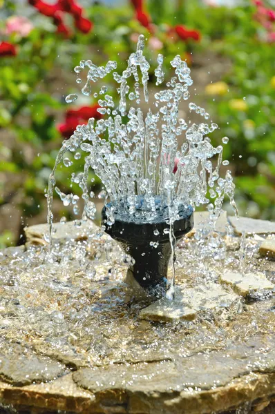 Little fountain in the garden