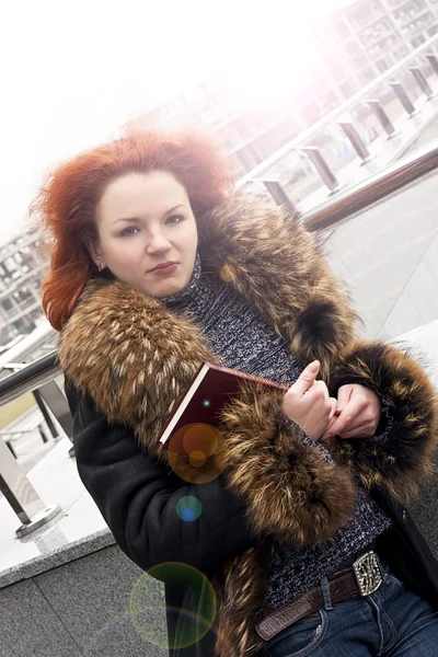 Sensual young woman with a book in her hands
