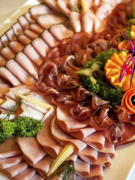 Buffet plate with different kinds of ham