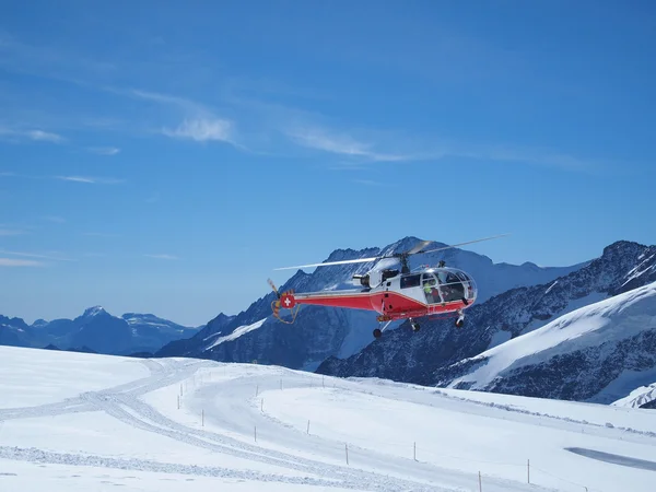 Helicopter take-off at Jungfraujoch Top of Europe in the Swiss M