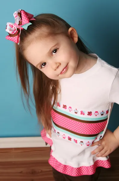 Little girl modeling hair bow and matching shirt