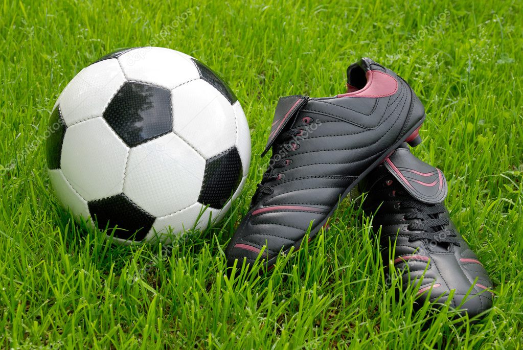 soccer shoes and ball