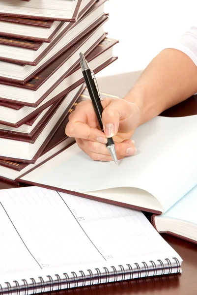 Person hand with pen signing book document