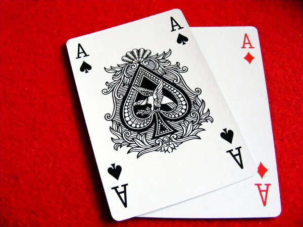 A pair of aces on red felt