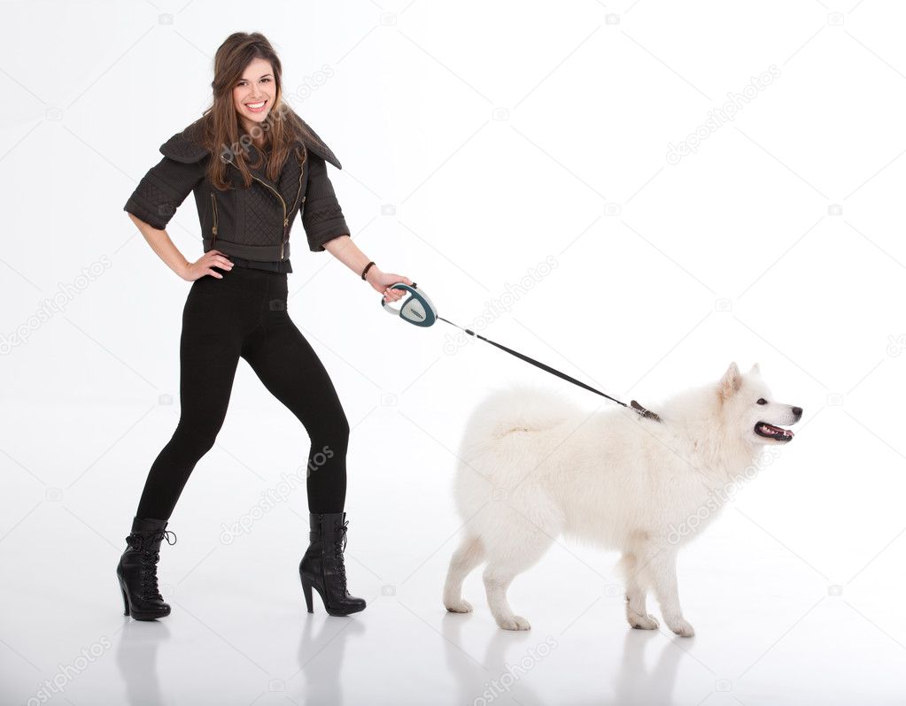 depositphotos_4371380-Young-woman-walking-a-white-dog-viewed-from-a-side.jpg