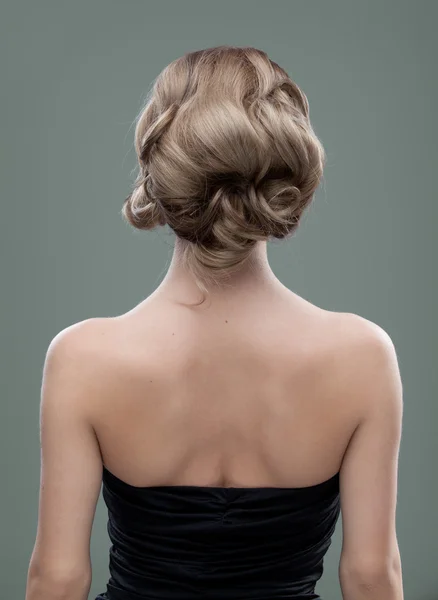 Head and shoulders back image of a young woman with beautiful ha