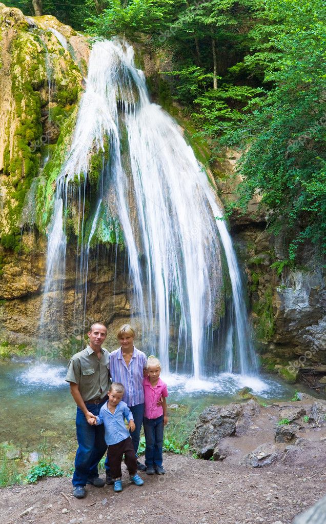 Family On Summer Waterfall Background Family On Summer Waterfall Background Stock Photo