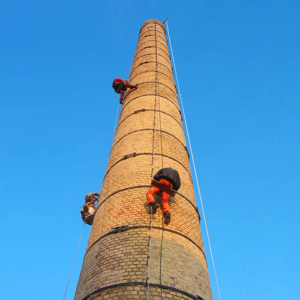 Workers on chimney