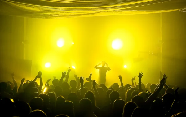 Underground club music concert with yellow lights