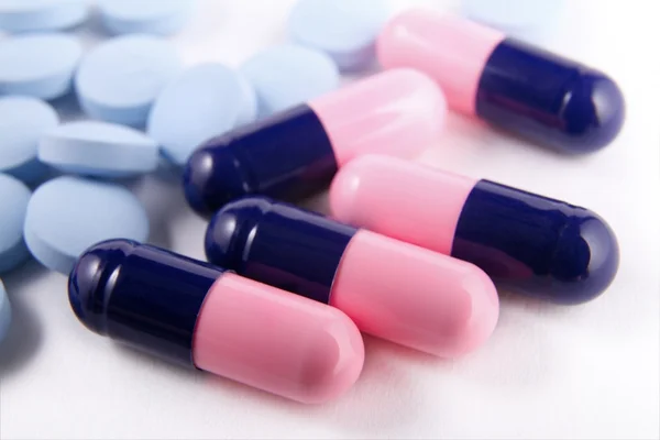 Antibiotic capsules and pain reliever pills
