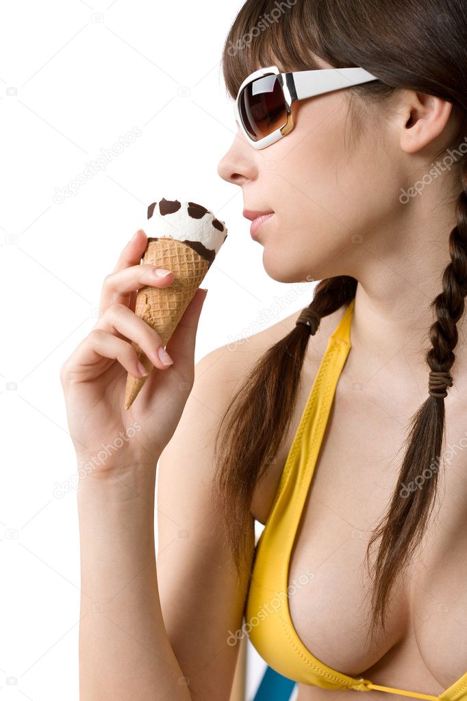Beautiful woman in bikini with ice cream cone and sunglasses in summer on ... Beautiful woman in bikini with ice cream cone and sunglasses in summer on ...
