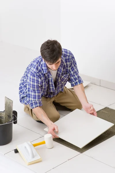 Home improvement - handyman laying tile