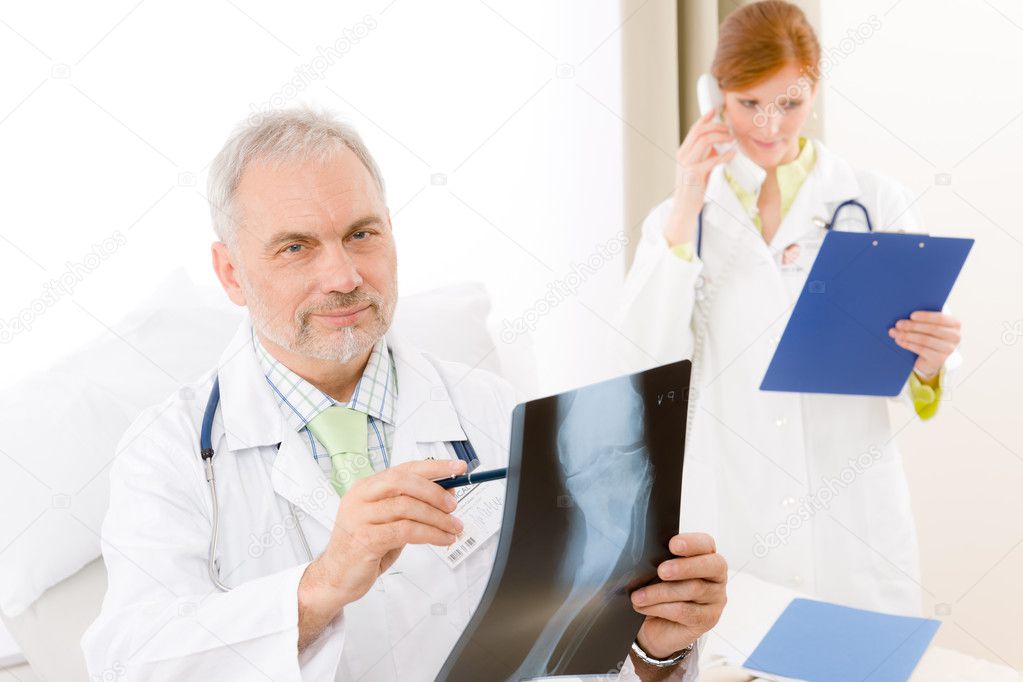 Medical team senior doctor examine xray in hospital