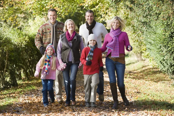 Multi-generation family on walk through woods