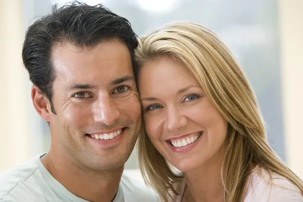 Couple indoors smiling