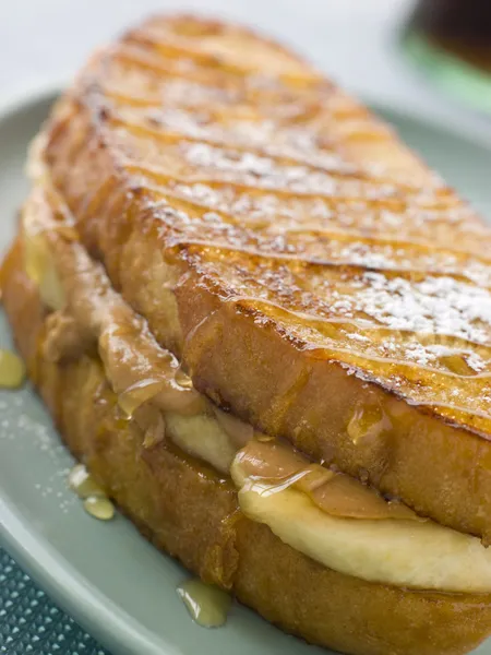 peanut butter and banana eggy bread sandwich with syrup