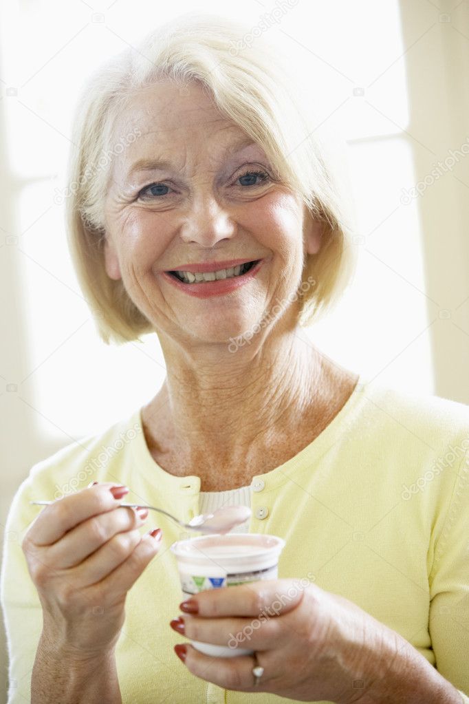 Woman Eating Yogurt