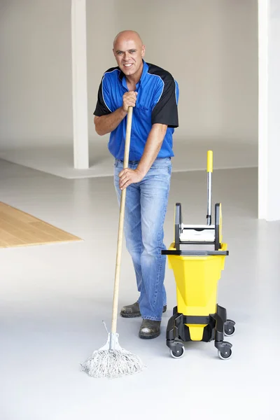 Cleaner mopping office floor — Stock Photo #4815232