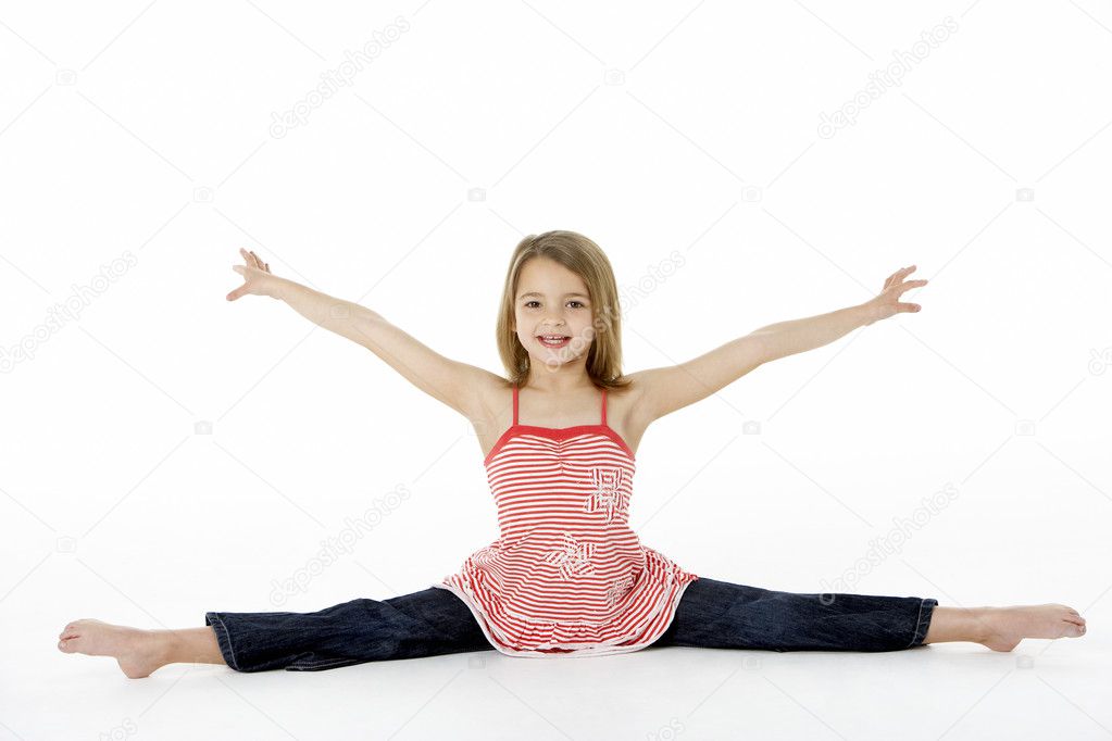 Flexible Little Girl Gymnast Doing Splits Stock Photo 