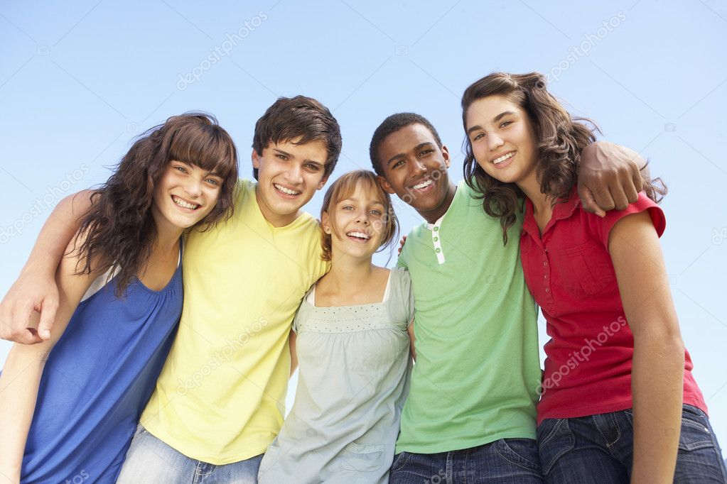 Group Of Teenage Friends Standing Outside Stock Photo Monkeybusiness