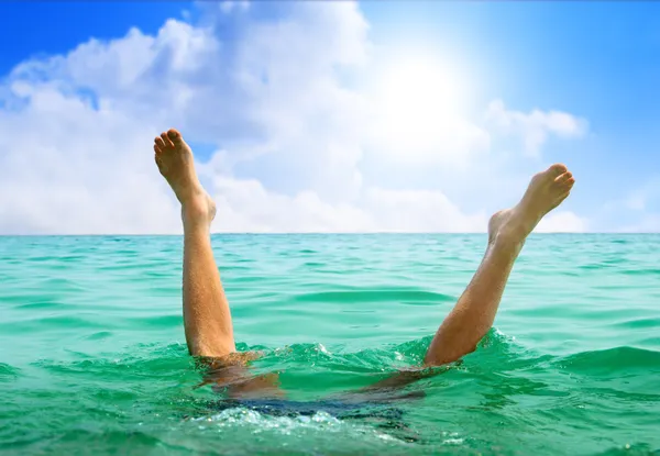 Man jumping in ocean