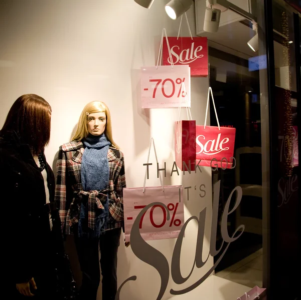 Womans Clothing Store Window In Sale Season