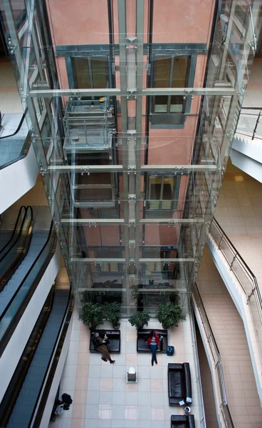 Glass elevator shaft in a modern office building