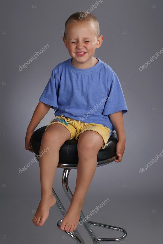 Adorable kid sitting on chair in studio — Stock Photo © GloriaAlfa 4803314