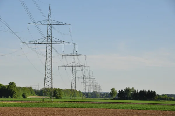 High voltage towers in line