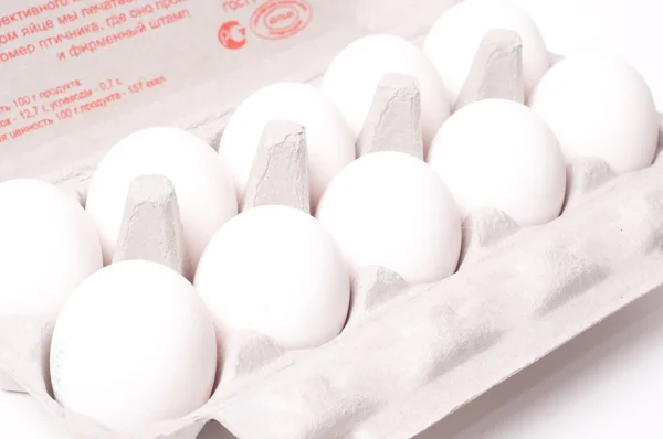 Eggs in pack on white background