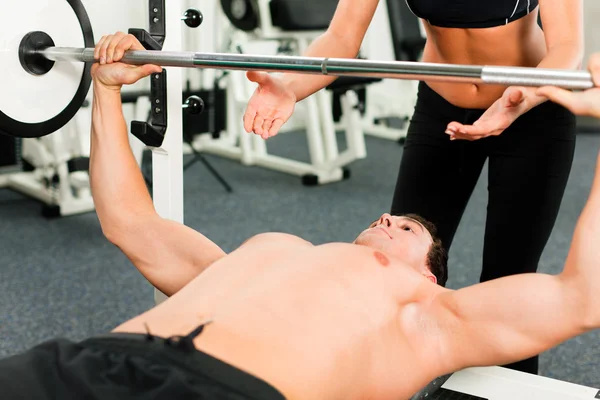 Man in gym with personal