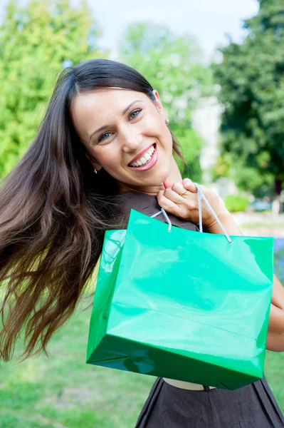 Beautiful happy woman with bag — Stock Photo #5159990
