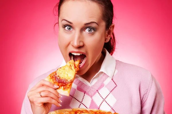 Funny woman eating pizza