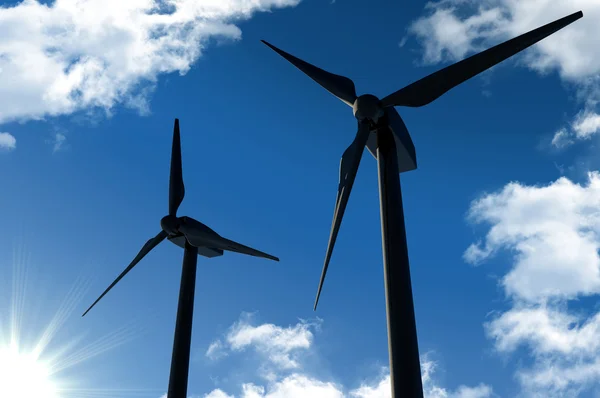 Wind turbines on sunny blue sky