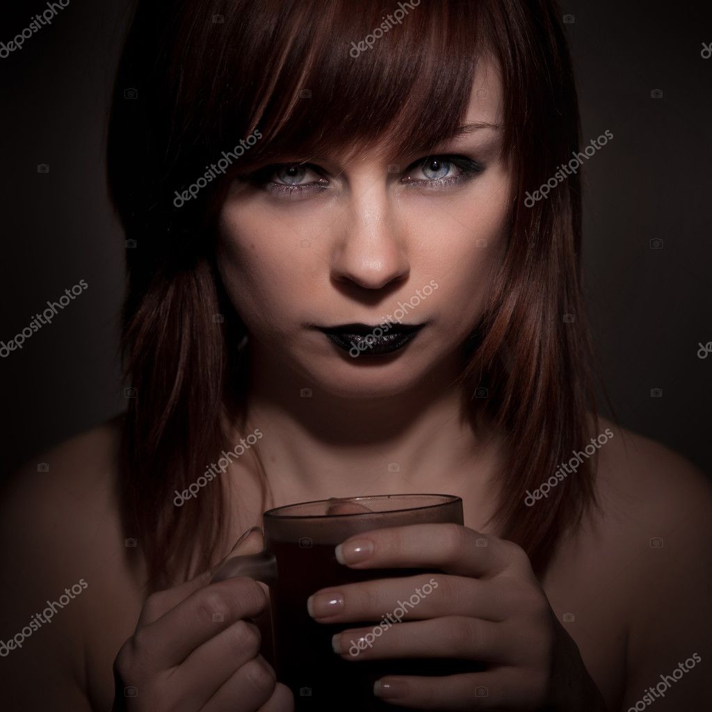 Woman Holding Lipstick