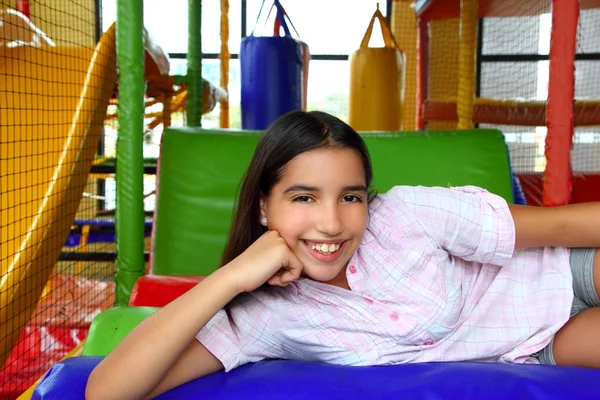 Latin indian teen girl smiling in playground schoolgirl by TONO BALAGUER SL